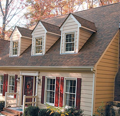 brown house with black metal roof|reddish brown roof house colors.